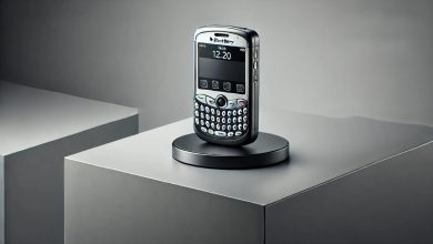 A BlackBerry Pearl 8110 smartphone on a modern desk, showcasing its small size, SureType keyboard, 2MP camera, and trackball navigation system, evoking nostalgia for early smartphone technology.