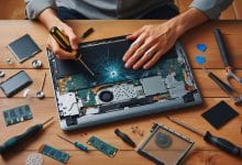 "Person replacing a broken laptop screen using screwdriver and replacement parts on a desk – DIY laptop screen repair"