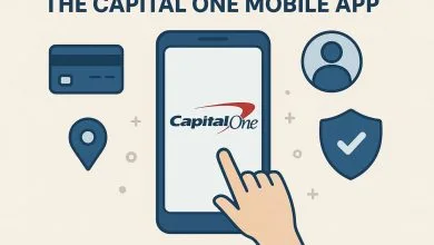 A flat-style digital illustration promoting the Capital One Mobile App. A large smartphone displays the Capital One logo, surrounded by icons representing banking features, with a human hand interacting with the screen. The color scheme includes beige, dark blue, and red for a clean, modern look.