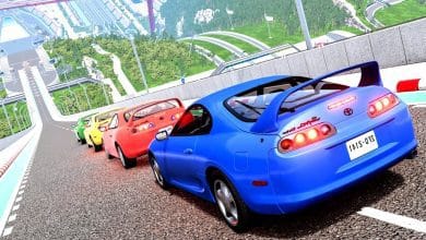 Colorful Toyota Supra cars lined up on a steep racetrack in a realistic racing simulator game, showcasing a high-speed virtual environment with detailed graphics and elevation.